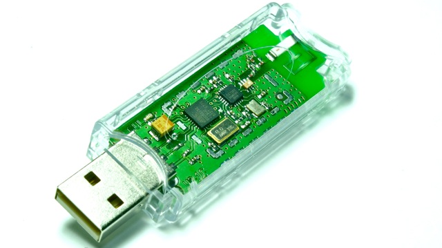 USB stick in a transparent case with the board visible