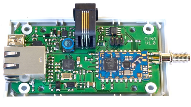 CUNO V1.0 in an open case, showing the RJ jack and the SMA antenna connector