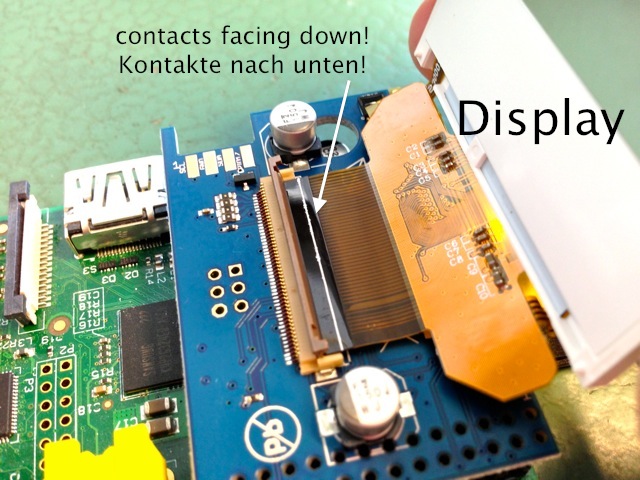 face contacts down and make sure white line runs at edge of the connector before closing the handle by pressing it down