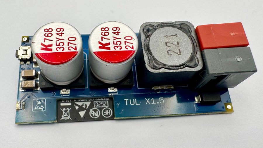 TULX from the component side: push button, two capacitors and an inductor, and the KNX bus terminal, from left to right
